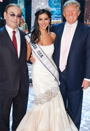 Rima Fakih’s whole world is about to change as she pauses to pose with Judge Phil Ruffin (L), and Donald Trump (R) on stage after the 59th annual MISS USA competition before embarking on her world-wide promotional tour.