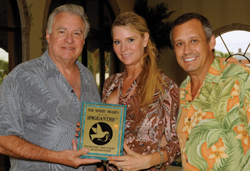 Carl Dunn presents the Spirit Award to David and Jacqueline Siegel