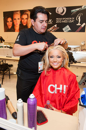 Miss Idaho USA has her hair done by a CHI stylist during Registration & Fitting.