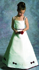 Model wearing a children's gown by Jacquelin Bridals