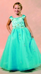 Model wearing a children's gown by Jacquelin Bridals